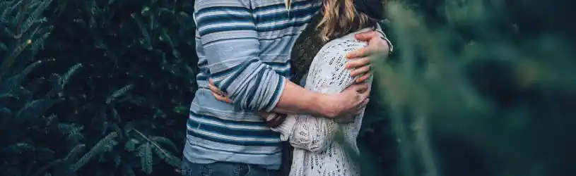 Is your spouse cheating on you? Our private investigators will find out the truth. Cheating Spouse - A kissing couple under surveillance.